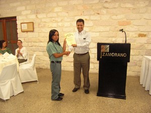 Yuri Tecún receives a diploma from Zamorano authorities after ranking seventh in class.