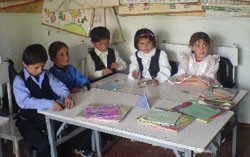 Children at Yazgulam's School No. 22 enjoy interactive lessons, part of innovative changes suggested by a USAID education initia