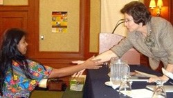 Supreme Court Justice Beatriz De León de Barreda (right) helped launch a public awareness campaign on domestic violence, one of 