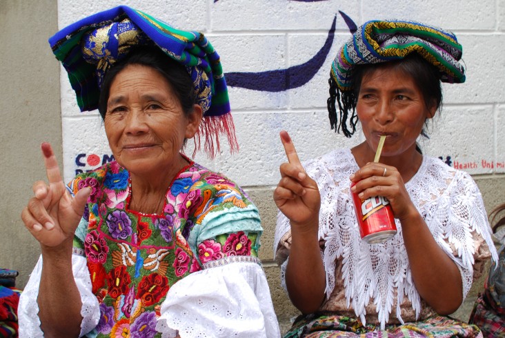 K´iche´maya women show their inked fingers after voting. 