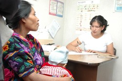 A Guatemalan indigenous woman discusses options with a family planning counselor at a Ministry of Health facility in Chichicaste