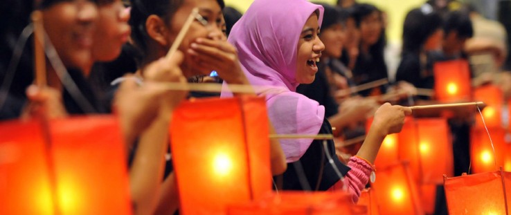 Indonesian youth hold lanterns during a candle-light vigil to mark World AIDS Day in Jakarta Dec. 1, 2009. More than 30 million 
