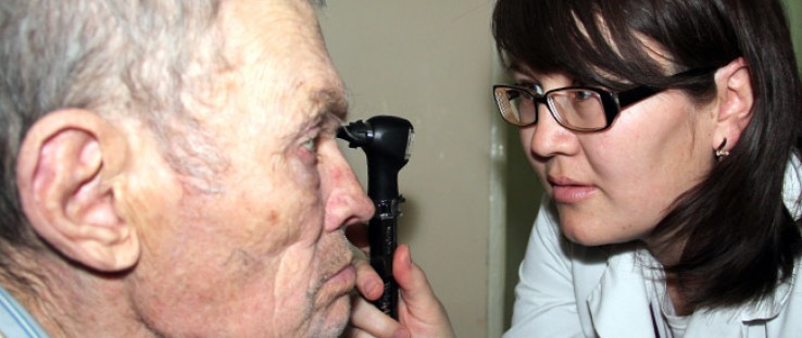 Dr. Cholpon Sadyrbaeva examines an elderly patient in Bishkek, Kyrgyzstan.