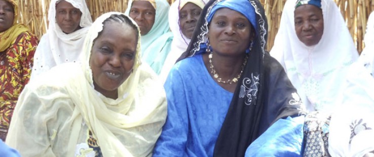 Seated among other women from the village, Madame Moringa poses for a photo in April 2012.