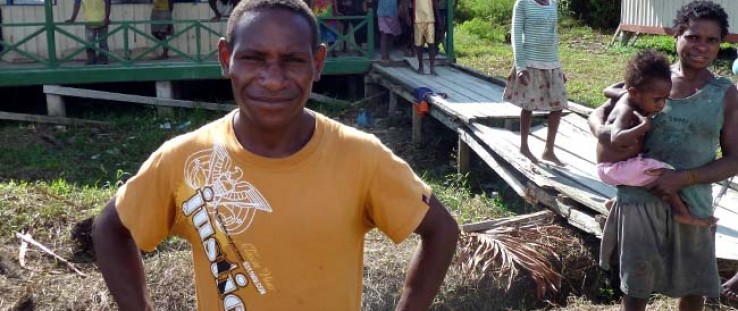 A volunteer teacher in front of the recently built Kokamu Parallel School in Dekai, Yahukimo District, Papua. 