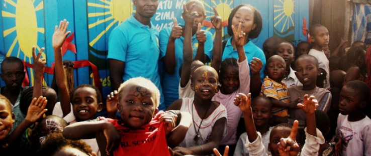 Sanergy hosts a marketing event in a Kenyan community to generate demand for its low-cost, hygienic sanitation centers. The toil