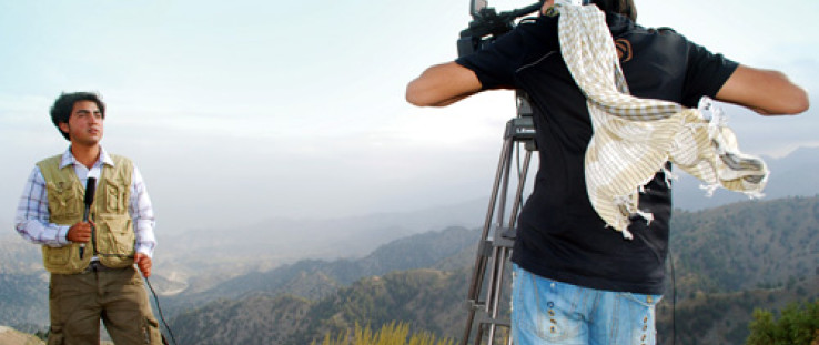 On the Road host Mujeeb Arez works on location in Paktya province, Afghanistan.