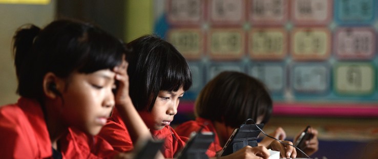 Students use tablet computers at the Ban San Kong school in Mae Chan, northern Thailand.