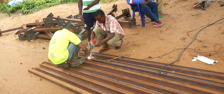 A local welder fabricates the photovoltaic array structure designed by GVE Projects.