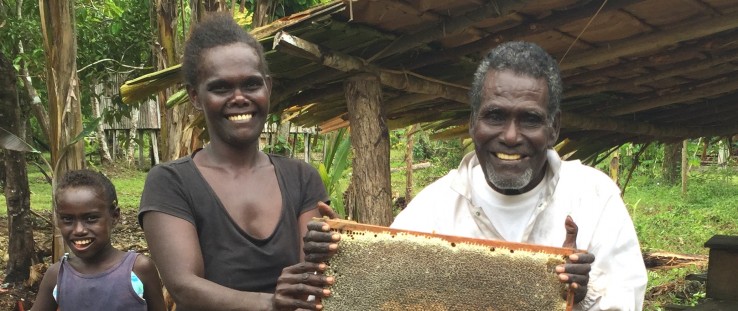 Mendana Tutikera of Pine village in the Solomon Islands harvests honey. With income from his bees, he pays school fees for his g