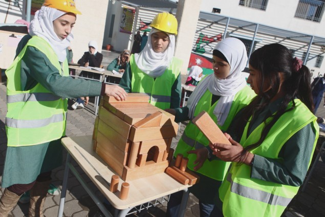 High school girls build their own designs at the opening of an all-girls K-12 school in Jordan.
