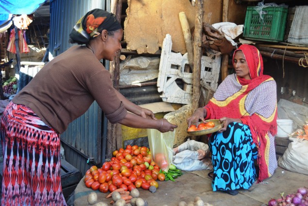 Adebo Berta, a widow and mother of four children, sells vegetables at a local market just few meters from her house.