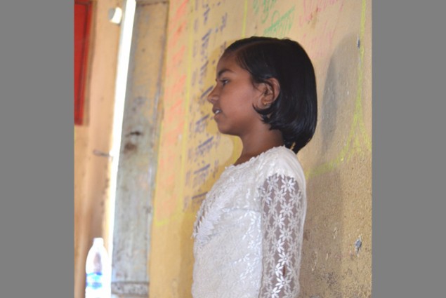 In the Beed district of Maharashtra, a student presents her own story based on the words written on the board. Children have the