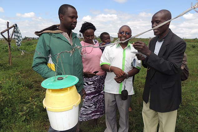 Farmer forecasters and MoA staff proudly posed next to an OFDA supplied phromone trap, Konabaridi, Kenya