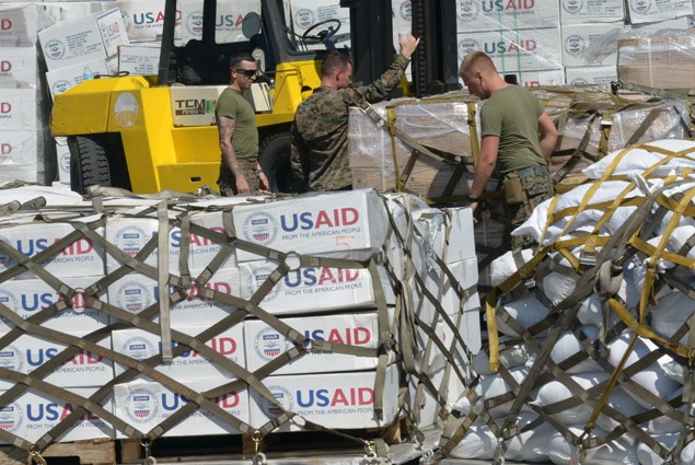 US marines prepare relief goods before they are loaded onto a US KC-130 plane for victims of Super Typhoon Haiyan in Tacloban, a