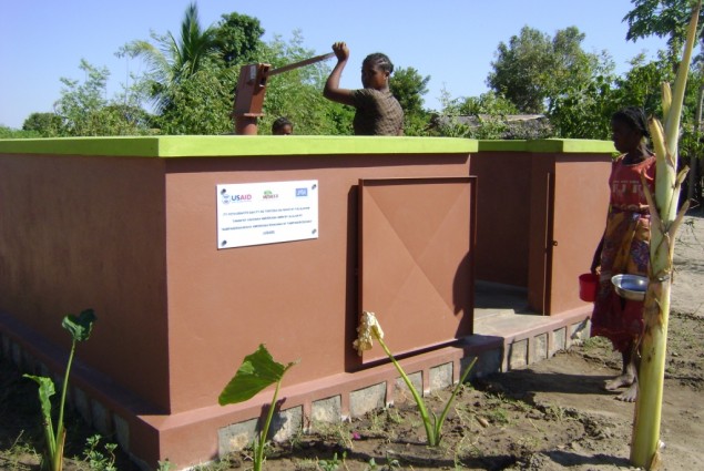 Beneficiary using water tap provided by USAID-funded JSI/Mahefa project