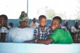 Smiling family at Engender Health supported clinic in Mwanza, Tanzania