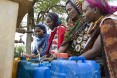 Women fill their jerry cans at a water point rehabilitated by USAID. For most rural areas of Ethiopia, water points are the main source of water for households.