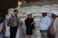 Representatives of USAID partner Relief Society of Tigray (right), describe the food distribution system in Hawzien to USAID Office of Foreign Disaster Assistance Director Jeremy Konydnyk (left) and U.S. Chargé d'Affaires to Ethiopia Peter Vrooman.