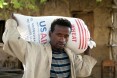 This man in Aje, Ethiopia carries home his family's wheat ration.