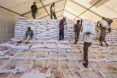 WFP collects and distributes food items for the Somali Region in Ethiopia in warehouses in Jigjiga. Workers offload sorghum bags (50 KG each) from a truck into the warehouse. USAID donated the food.