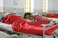 Women lying on beds in the fistula ward at Kundumini hospital in Bangladesh.