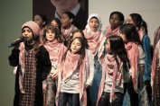 Female students perform a Jordanian national song in traditional attire at the opening of Khalwla Bint Al Azwar School in Mashar