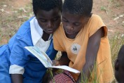 These two adolescent girls in Malawi are participating in an after-school reading camp that works in 10 primary schools reaching