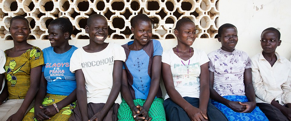 Teenage girls wait for health services at an adolescent clinic.