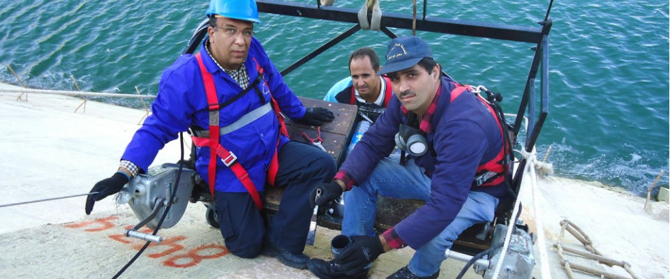 Technical staff inspect the face joints of a dam in Bekaa, Lebanon, through a USAID-funded program.