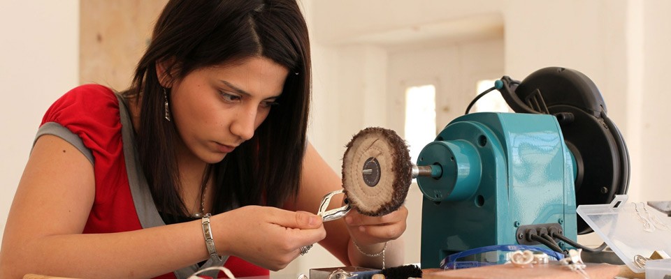 A girl attending a jewelry making course at Dar Al-Kalima College in Bethlehem