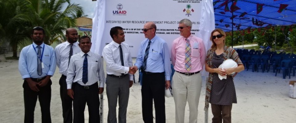 Dignitaries and USAID representatives pose for a photograph after the groundbreaking for a desalination plant in Hinnavaru