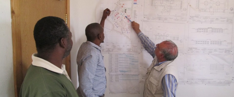 ASHA Senior Engineer Mohammad Latif reviews construction plans with ASHA partner St. Peter Claver High School in Tanzania