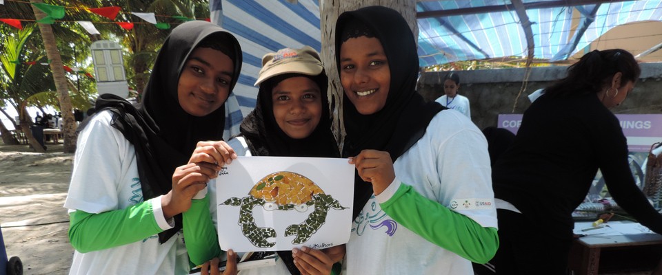 Students show creations made out of recyclables in Mathiveri, North Ari Atoll, Maldives