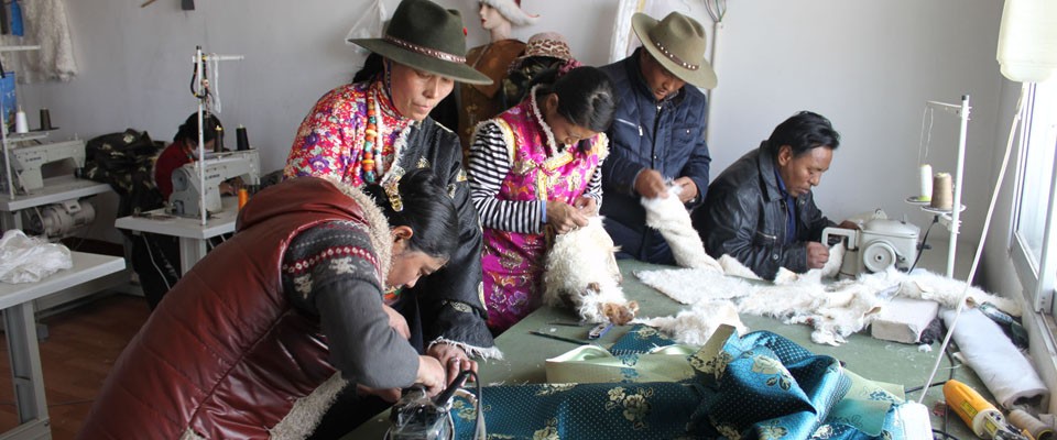 USAID trainees make traditional clothing in Ge-ermu City, Qinghai province, China.