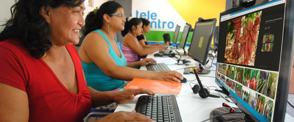 Women receiving digital and financial literacy courses at the Telecenter. 