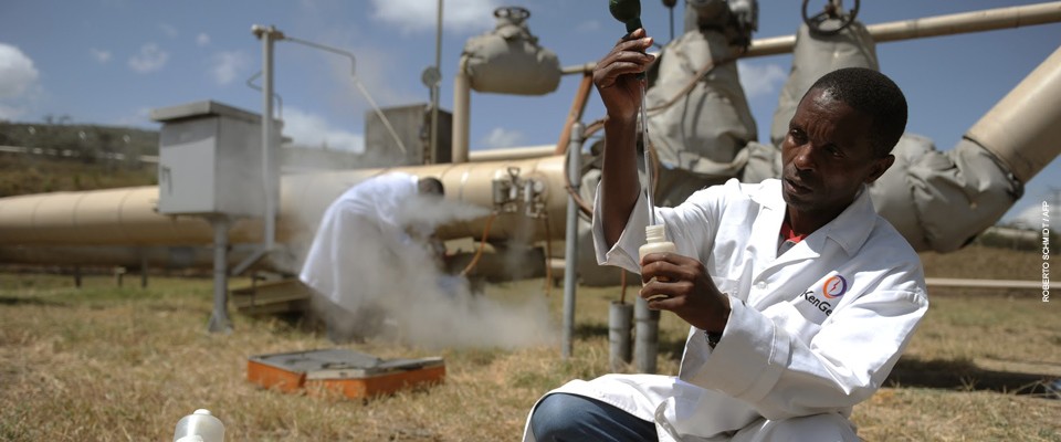 Kengen workers test a sample of condensed steam at a separator unit of a super heated steam well at the Olkaria geothermal plant