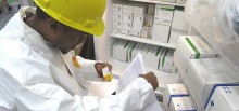 A warehouse staffer checks new stock of life-saving drugs for Guyana’s HIV/AIDS population.