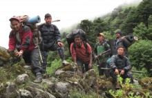 A community anti-poaching patrol in eastern Nepal removes snares and deters hunting and other illegal activities.