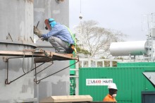 A laborer works on a USAID-funded power plant at Caracol Industrial Park in northern Haiti, April 2012.