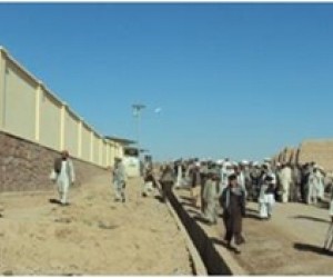 Residents stroll down the rehabilitated main road lined by new solar lights in the Muqur District center.