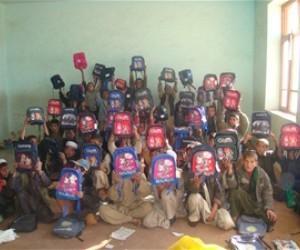 School children at the Babrak School in Paktya display their new backpacks.