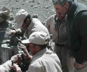 Kormal (top center) works with other rangers to set up a camera trap in the Wakhan. Under his leadership, they became the first 