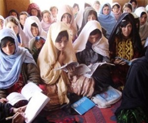 Women learn to read in a literacy class established by the community development council.