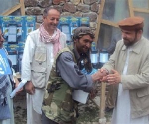 Badakhshan Governor Shah Wali Adeeb presents a lantern to a recipient, while Eng. Pir Mohammad Yaftali, MRRD Director for Badakh
