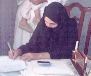 Mrs. Laila of Kandahar Province signs the papers legally freeing her from marriage after her husband’s death eight years before.