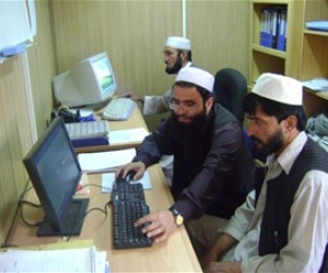 Employees of the Gardez Water Supply Department hard at work in their refurbished offices on new computers – both financed by a 