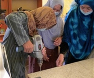 Women learn vocational skills at the Afghan Women’s Initiatives organization through funding and support from USAID.