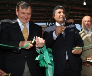 U.S. Ambassador Karl W. Eikenberry (left) and Minister of Agriculture, Irrigation and Livestock Asif Rahimi cut the ribbon to op