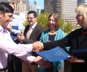 With Washington, D.C. in the background, Mirwais Attaulhaq (left) is congratulated by a representative of the International Lead